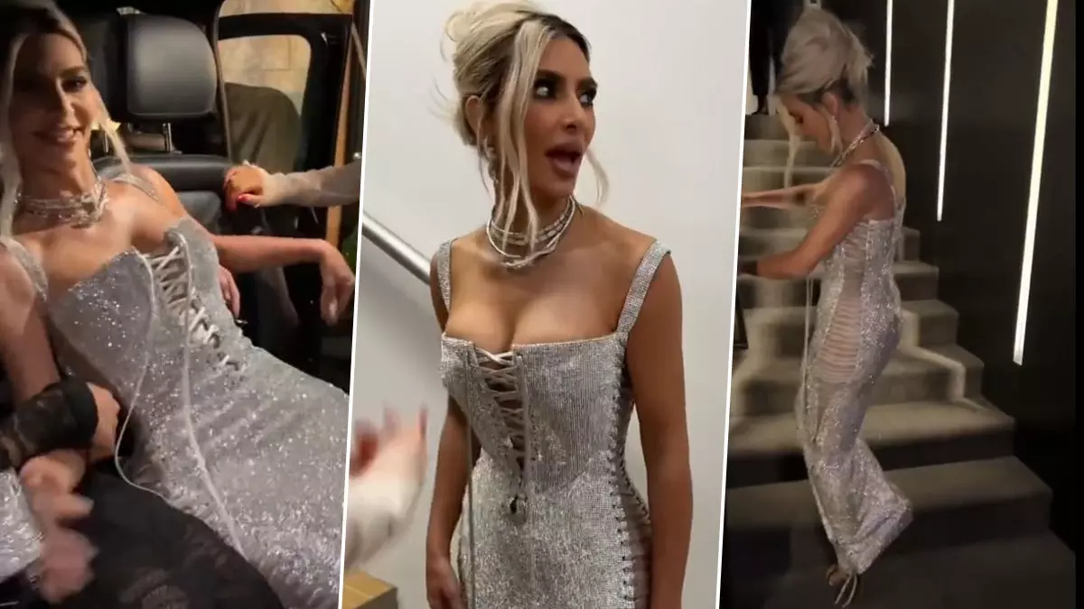 Kim Kardashian Viral Video: Kim Kardashian ने पहनी सिल्वर कलर की इतनी टाइट गाउन, सीढ़ी चढ़ने में छूटे पसीने (Watch Video)